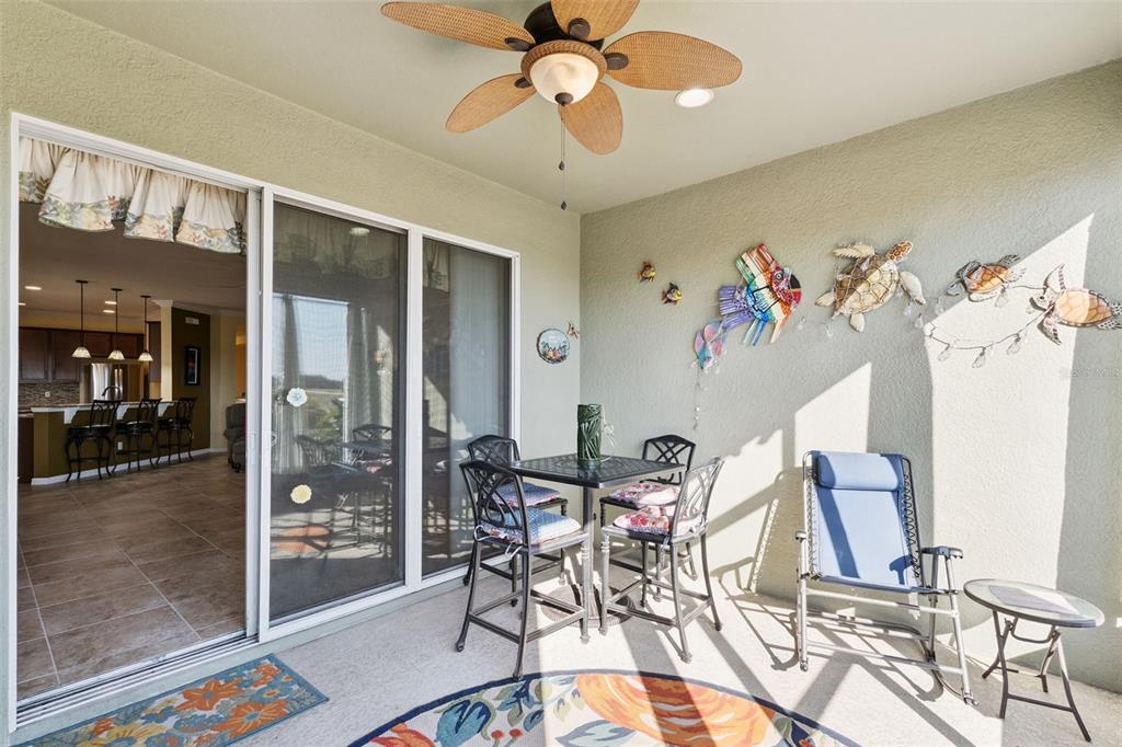 12332 Hammock Pointe Circle Clermont, FL 34711 - Photo 35 of 39 a view of a dining room with furniture and chandelier