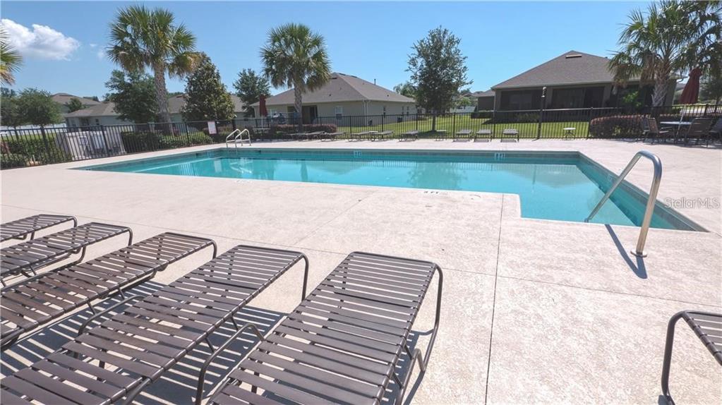 12332 Hammock Pointe Circle Clermont, FL 34711 - Photo 38 of 39 a view of swimming pool with outdoor seating and plants
