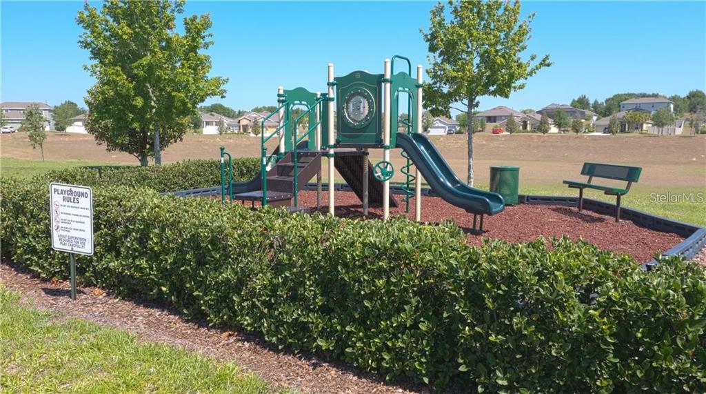 12332 Hammock Pointe Circle Clermont, FL 34711 - Photo 39 of 39 a view of a park with plants and a bench
