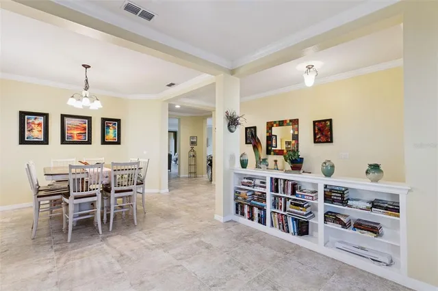 a dining room with furniture a rug and wooden floor