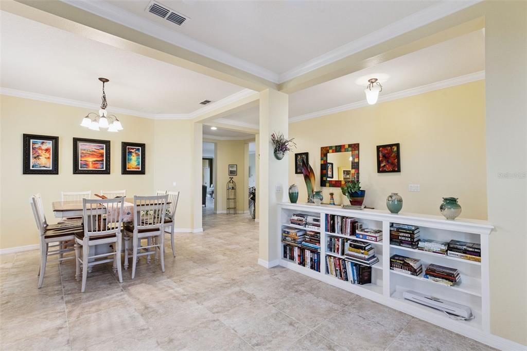 12332 Hammock Pointe Circle Clermont, FL 34711 - Photo 10 of 39 a dining room with furniture and wooden floor