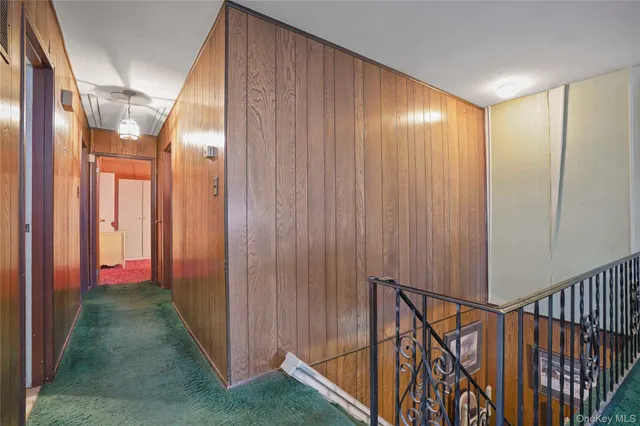 a view of gallery with wooden floor