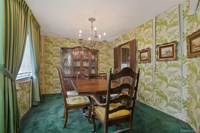 a dining room with furniture and chandelier
