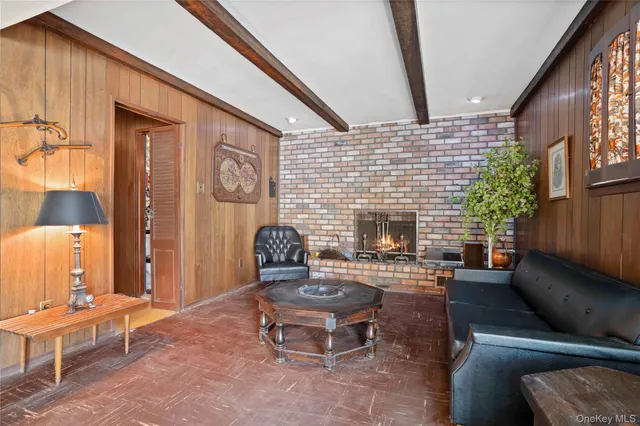 a outdoor living space with furniture and a fireplace