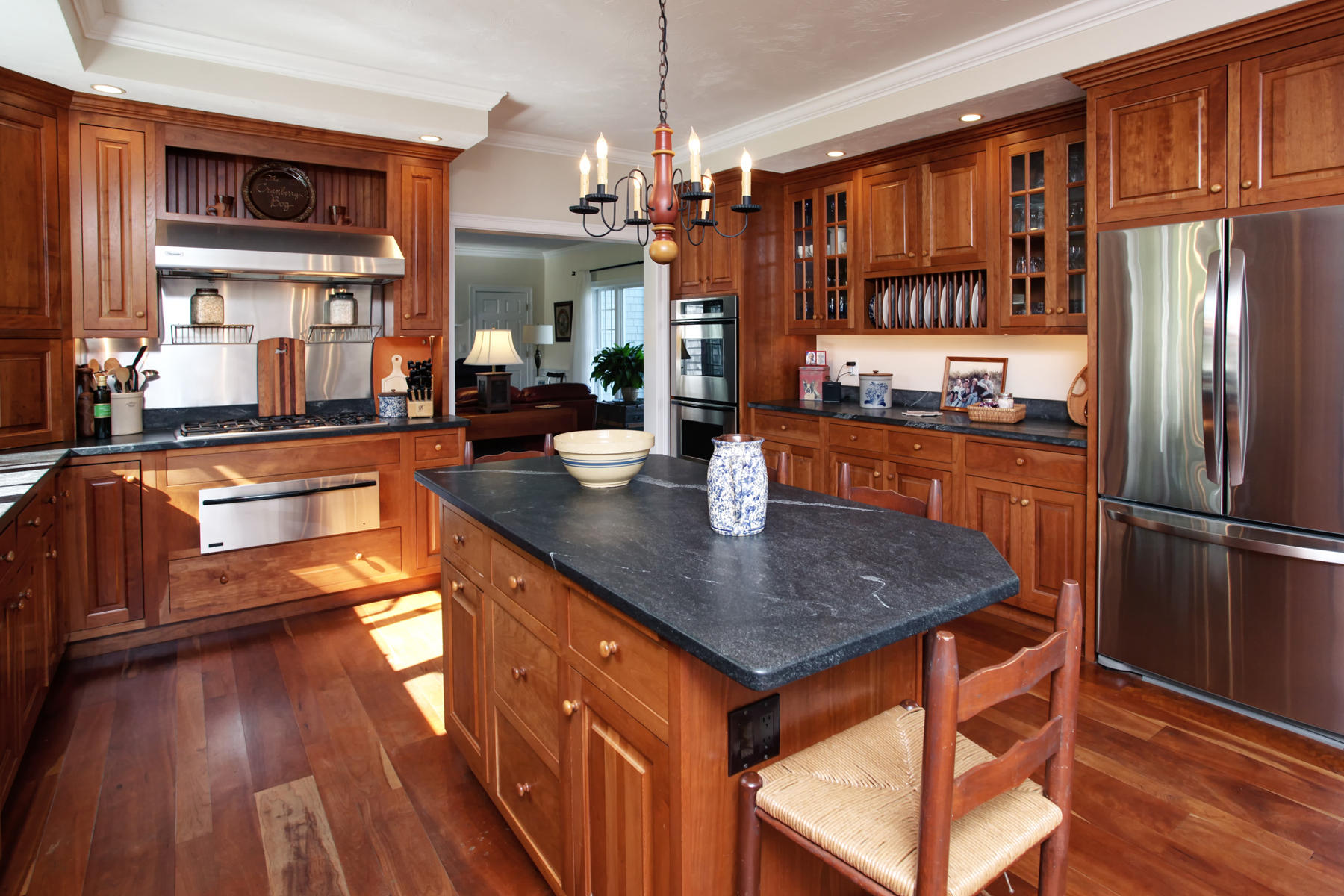 58 Torrey Road East Sandwich, MA 02537 - Photo 15 of 34 a kitchen with stainless steel appliances granite countertop a refrigerator a stove and a wooden floors