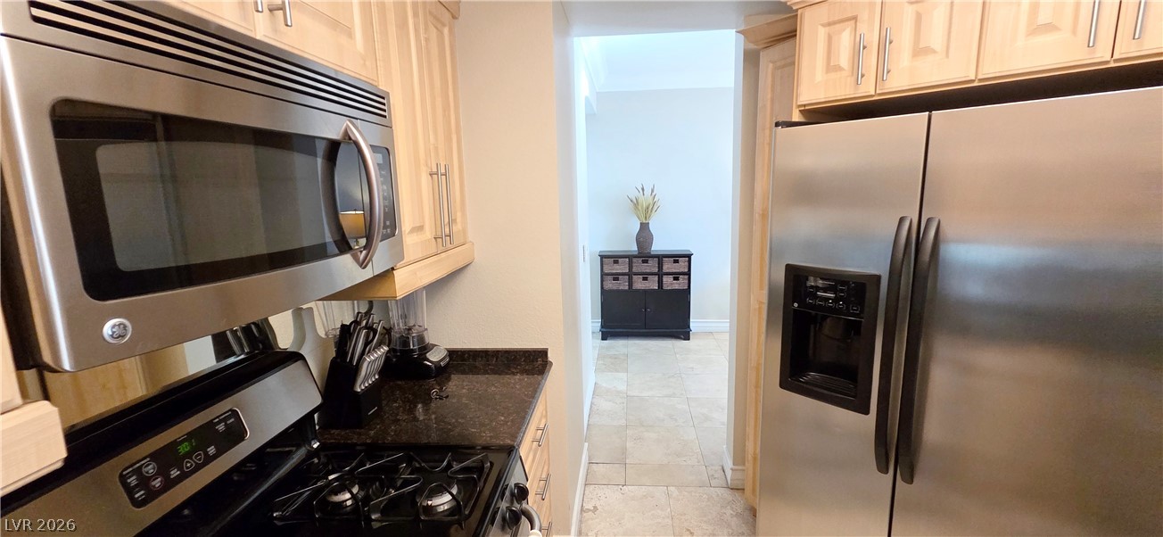 210 East Flamingo Road, Unit 208 Las Vegas, NV 89169 - Photo 18 of 42 Culinary convenience with modern stainless steel appliances and abundant cabinetry.