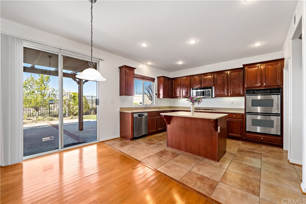 33782 Channel Street Temecula, CA 92592 - Photo 1 of 44 a kitchen with stainless steel appliances granite countertop a stove a sink a refrigerator and a wooden cabinets
