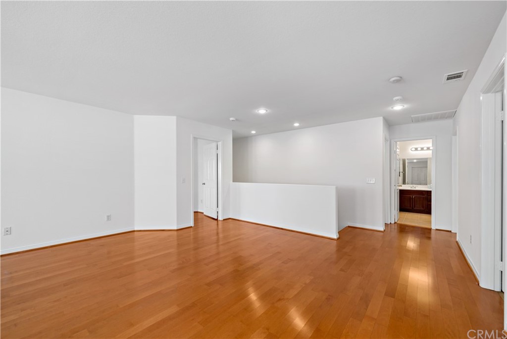 33782 Channel Street Temecula, CA 92592 - Photo 11 of 44 a view of an empty room with wooden floor