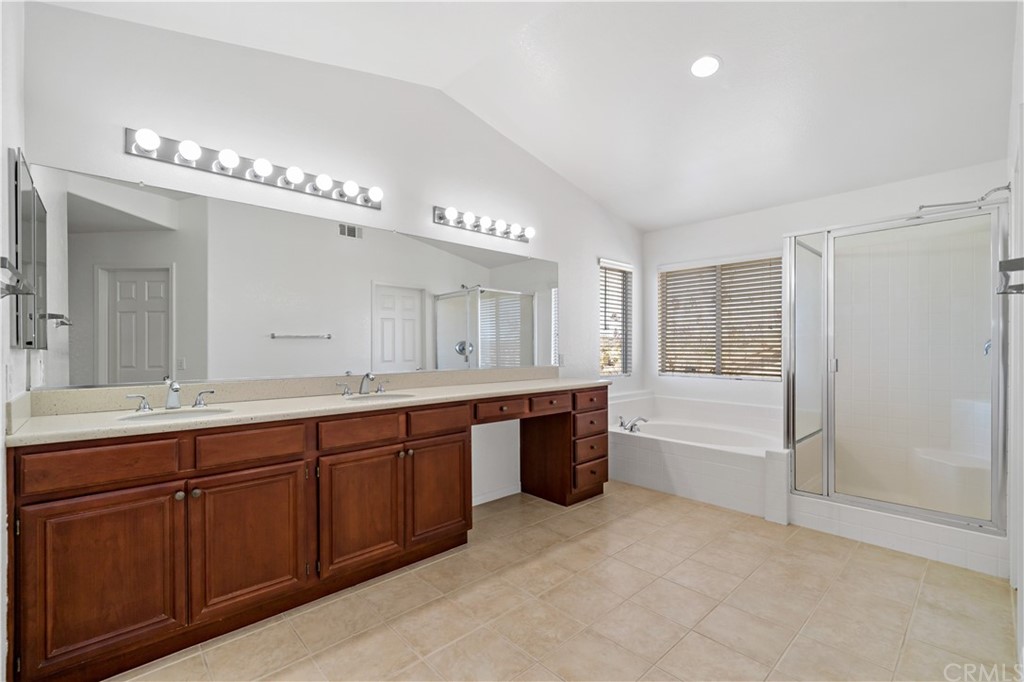 33782 Channel Street Temecula, CA 92592 - Photo 15 of 44 a large bathroom with a large tub and sink
