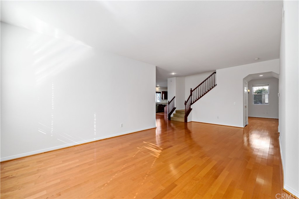 33782 Channel Street Temecula, CA 92592 - Photo 28 of 44 a view of an empty room with wooden floor and a potted plant