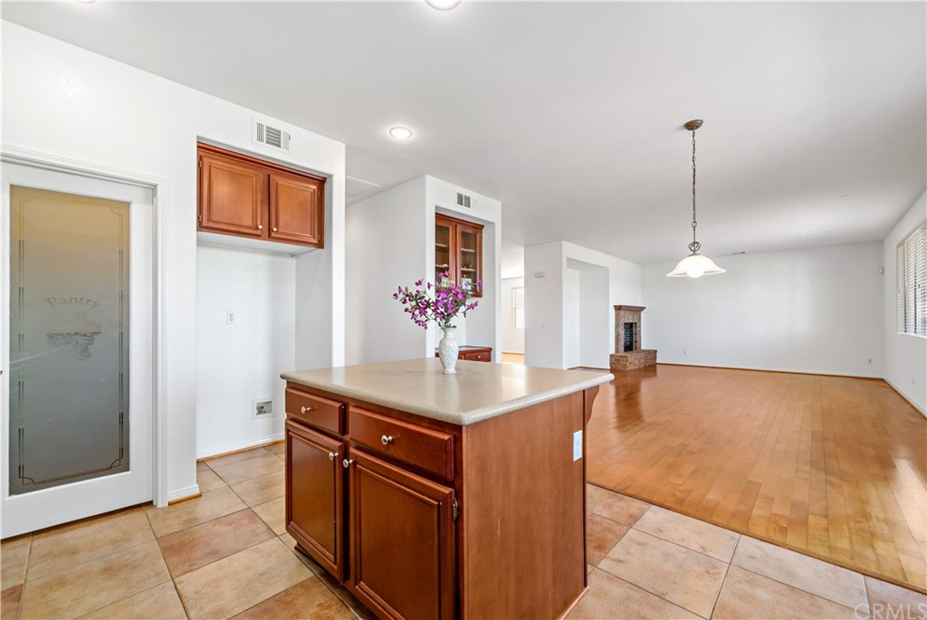 33782 Channel Street Temecula, CA 92592 - Photo 3 of 44 a kitchen with stainless steel appliances granite countertop a sink and a refrigerator