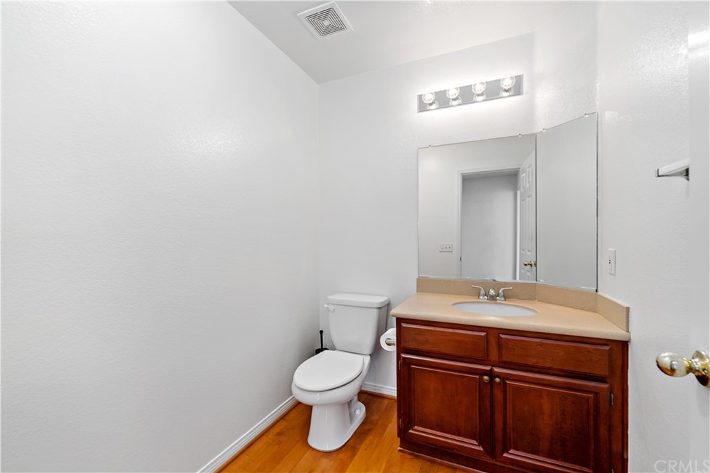 33782 Channel Street Temecula, CA 92592 - Photo 32 of 44 a bathroom with a sink a toilet and mirror