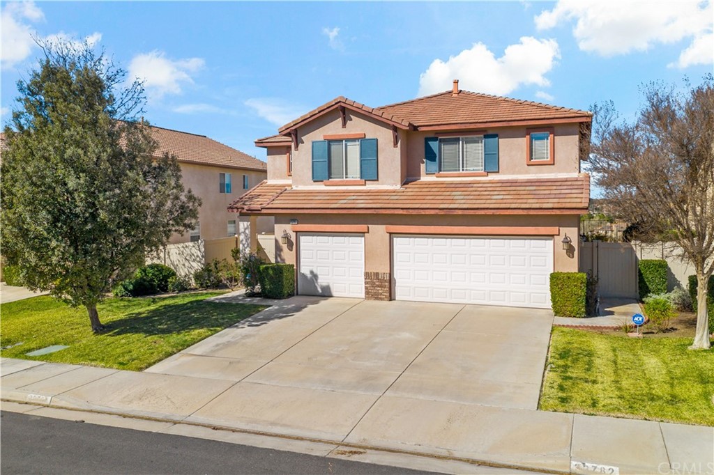 33782 Channel Street Temecula, CA 92592 - Photo 38 of 44 a front view of a house with a yard and garage