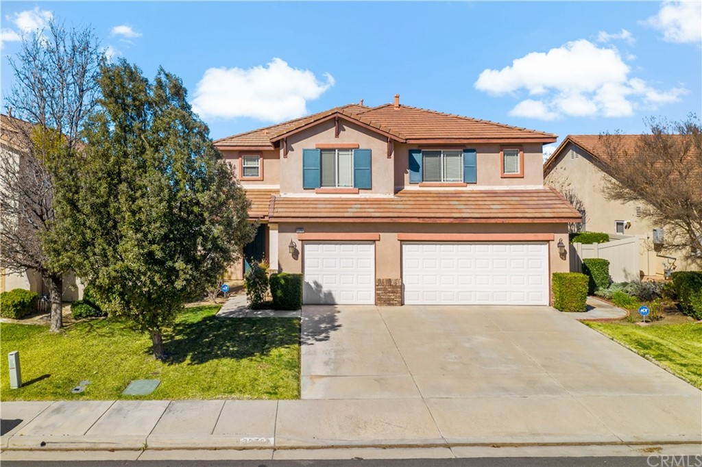 33782 Channel Street Temecula, CA 92592 - Photo 39 of 44 a front view of a house with a yard and garage