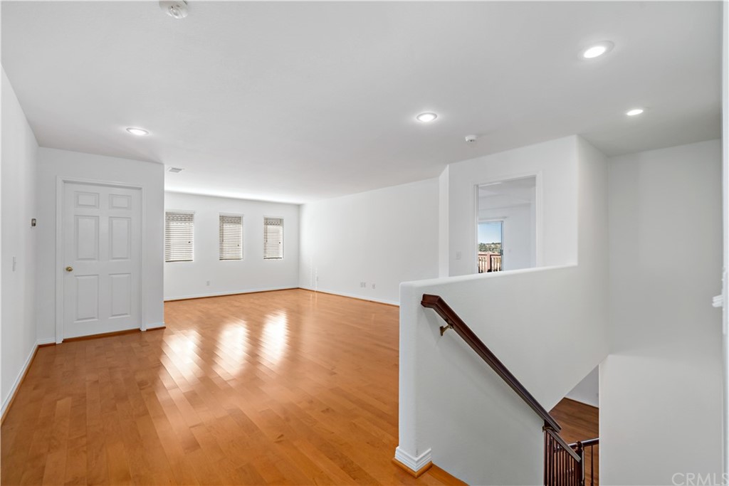 33782 Channel Street Temecula, CA 92592 - Photo 8 of 44 a view of empty room with wooden floor and fan