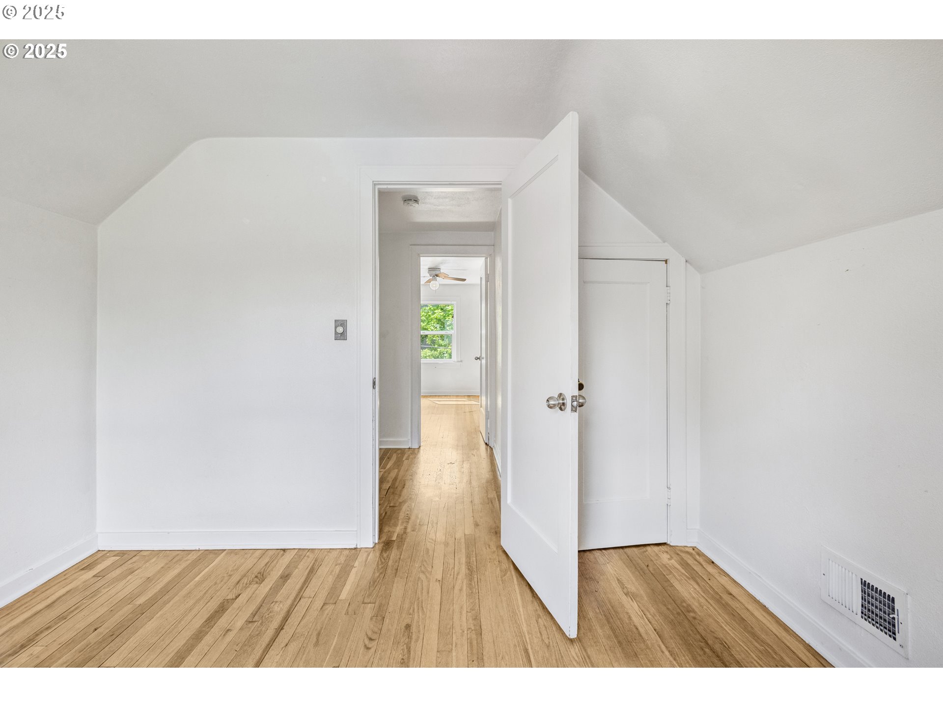 1391 West 5th Avenue Eugene, OR 97402 - Photo 18 of 35 a view of an empty room with wooden floor