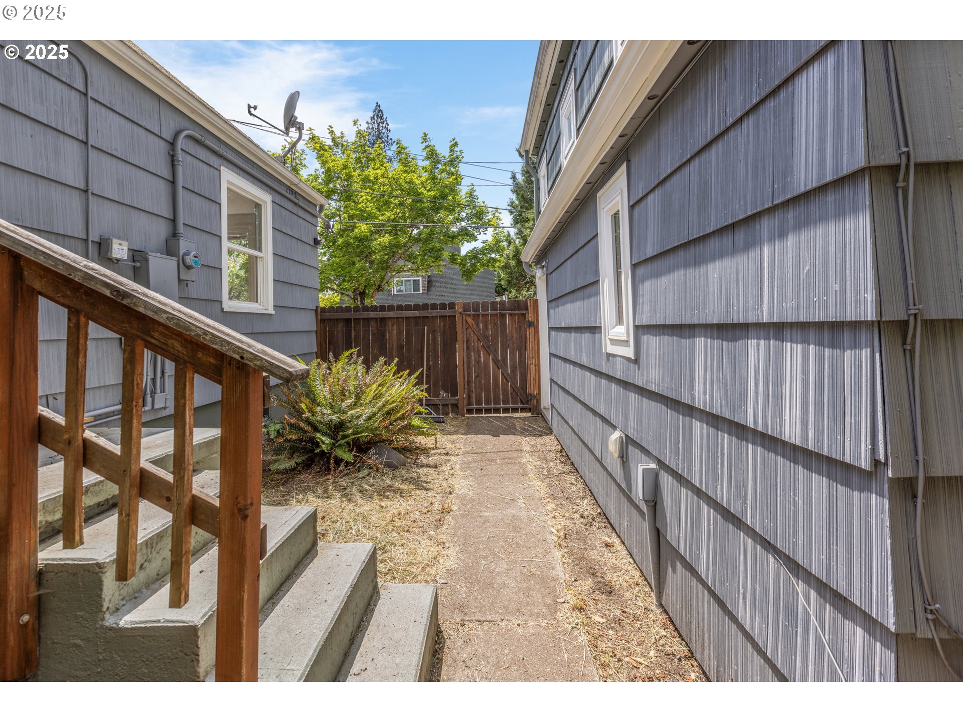 1391 West 5th Avenue Eugene, OR 97402 - Photo 27 of 35 a view of a house with backyard and wooden fence