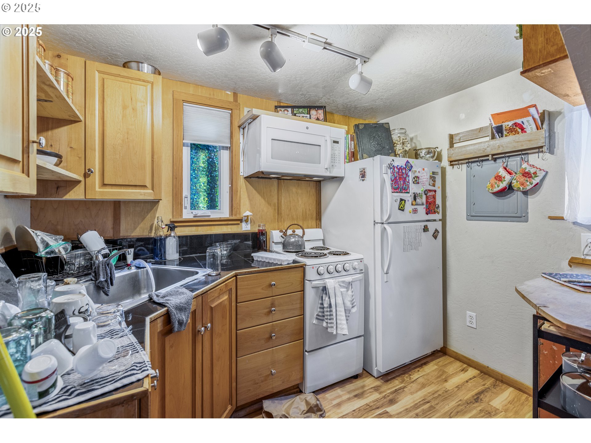 1391 West 5th Avenue Eugene, OR 97402 - Photo 32 of 35 a kitchen with refrigerator and window