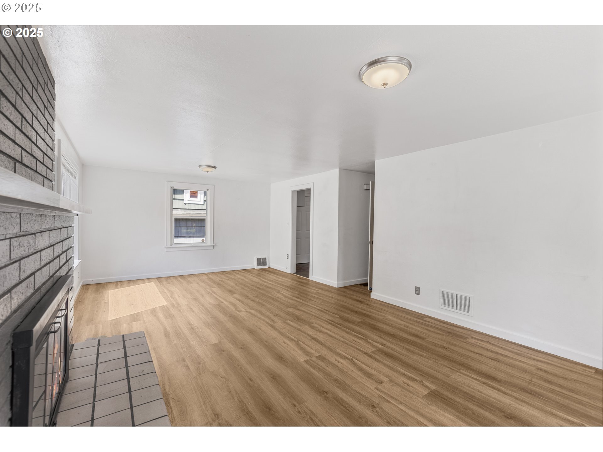 1391 West 5th Avenue Eugene, OR 97402 - Photo 7 of 35 a view of an empty room with a window