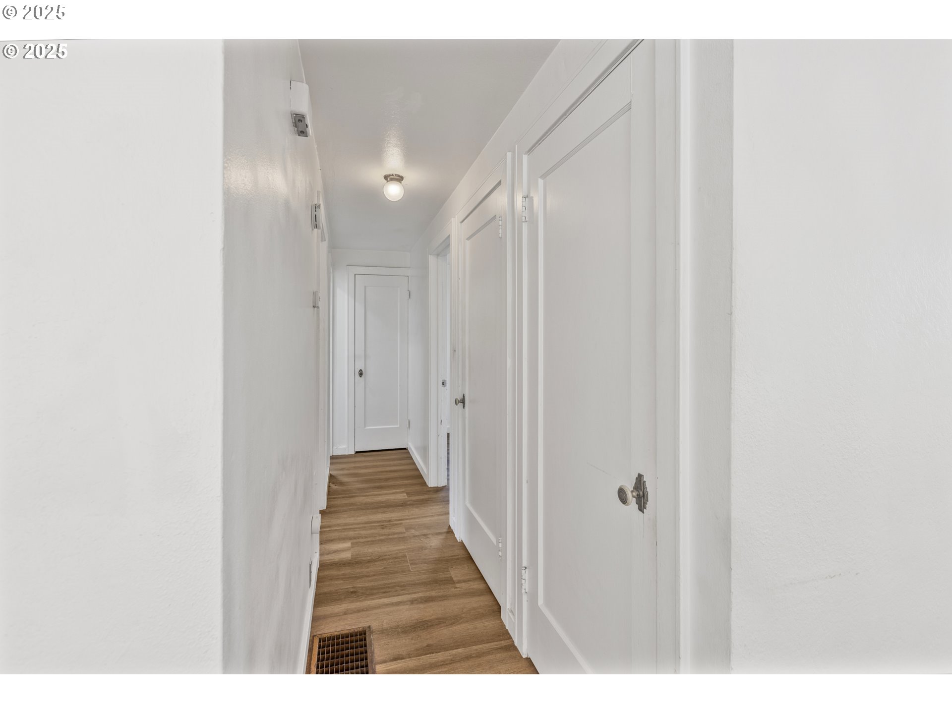 1391 West 5th Avenue Eugene, OR 97402 - Photo 8 of 35 a view of a hallway with wooden floor