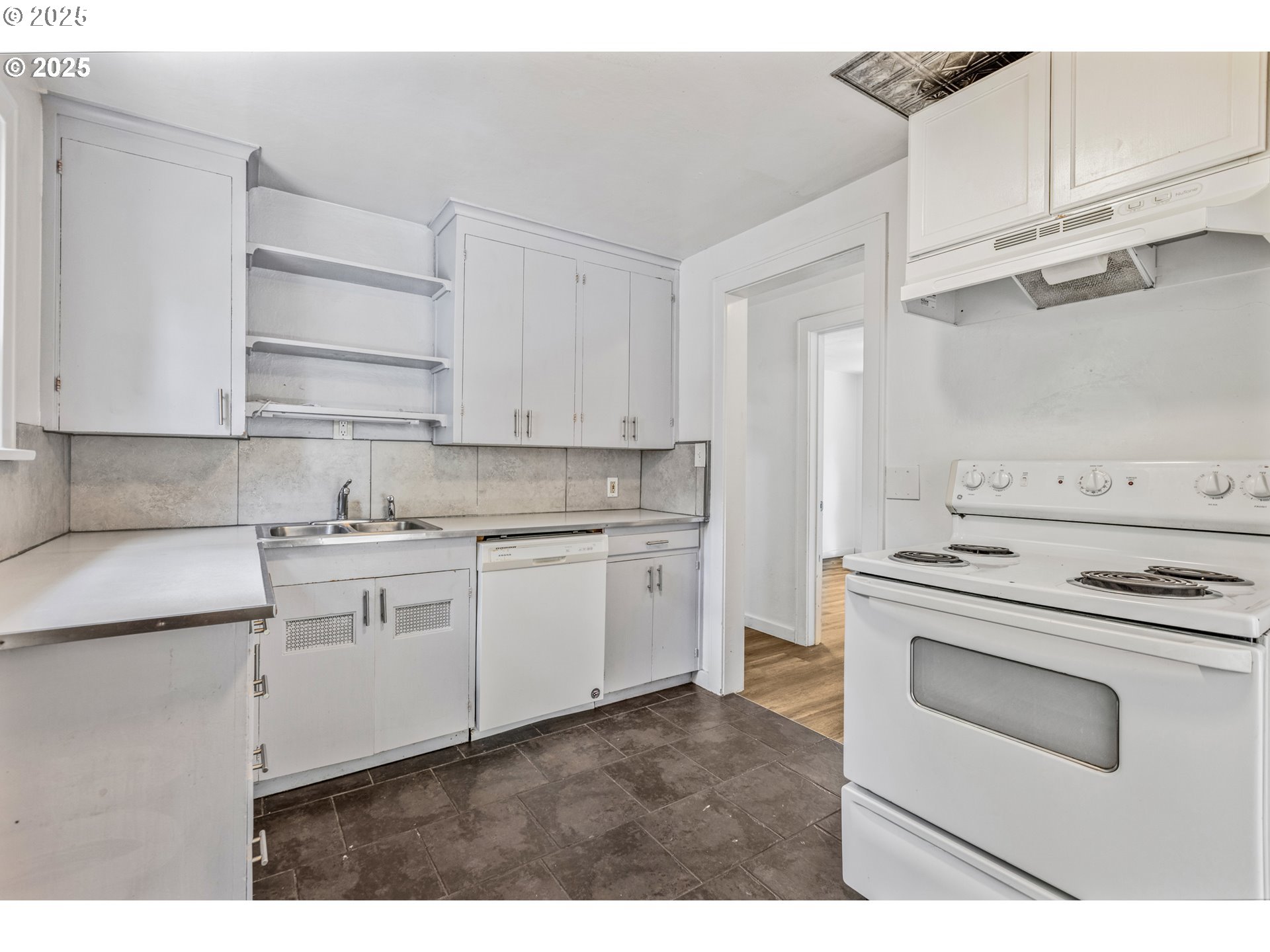 1391 West 5th Avenue Eugene, OR 97402 - Photo 10 of 35 a kitchen with cabinets appliances and a sink