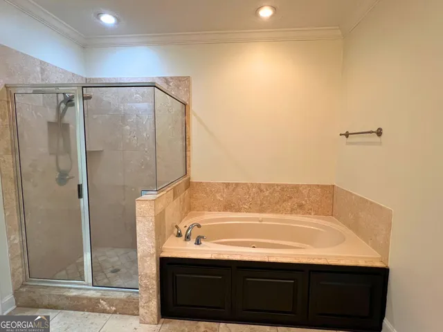 a bathroom with a bathtub and a sink