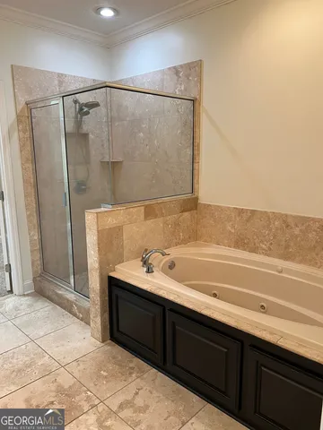 a bathroom with a bathtub and a sink