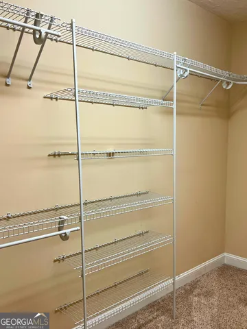 a view of an empty walk in closet