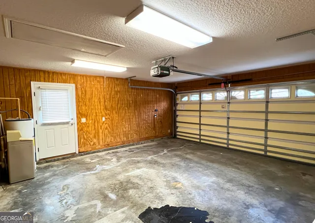 a view of a floor to ceiling window next to a yard