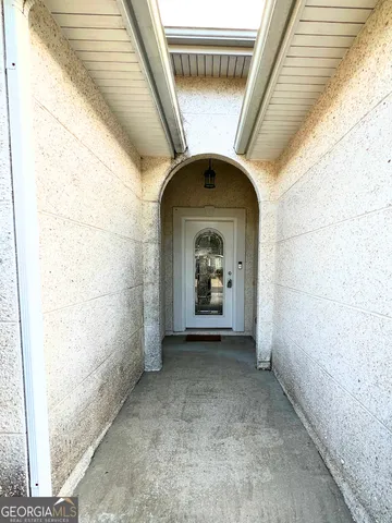 a view of an empty room with a fireplace