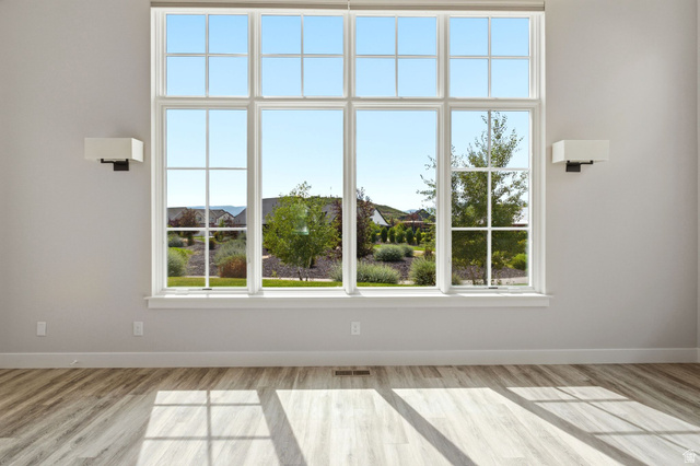 496 North Farmhouse Way, Unit 11 Midway, UT 84049 - Photo 16 of 50 Expansive multi-pane window with white trim and a surrounding landscaped exterior