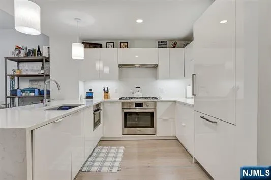 a kitchen with a stove and a refrigerator