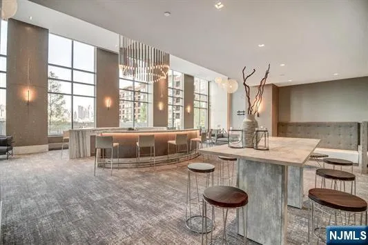 a kitchen with counter top space and dining table