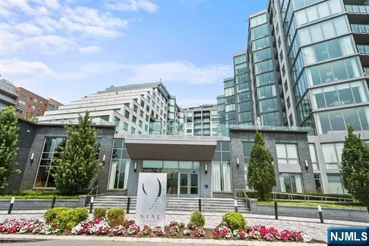 front view of a building with a garden