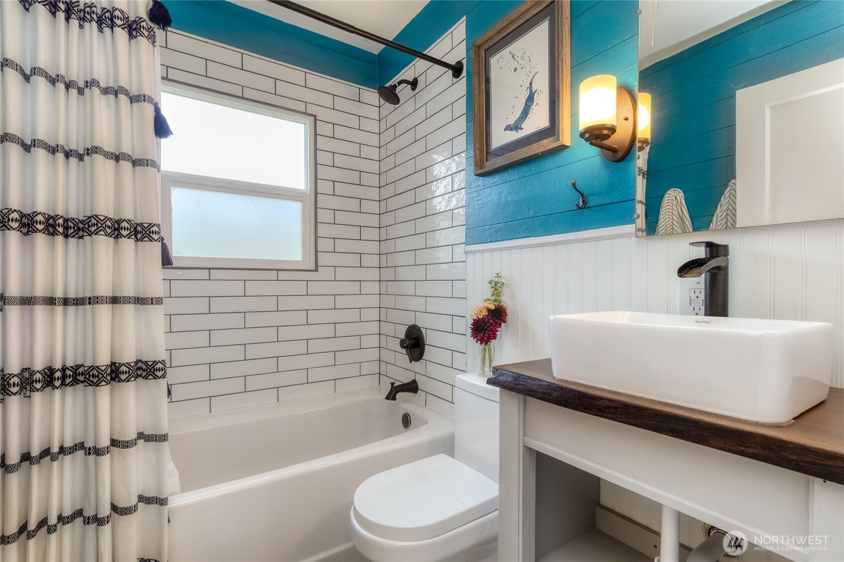 1028 University Street Walla Walla, WA 99362 - Photo 11 of 27 a bathroom with a bathtub a sink and a toilet