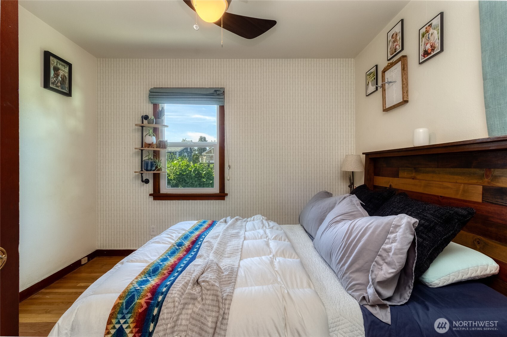 1028 University Street Walla Walla, WA 99362 - Photo 12 of 27 a bedroom with a bed and a window