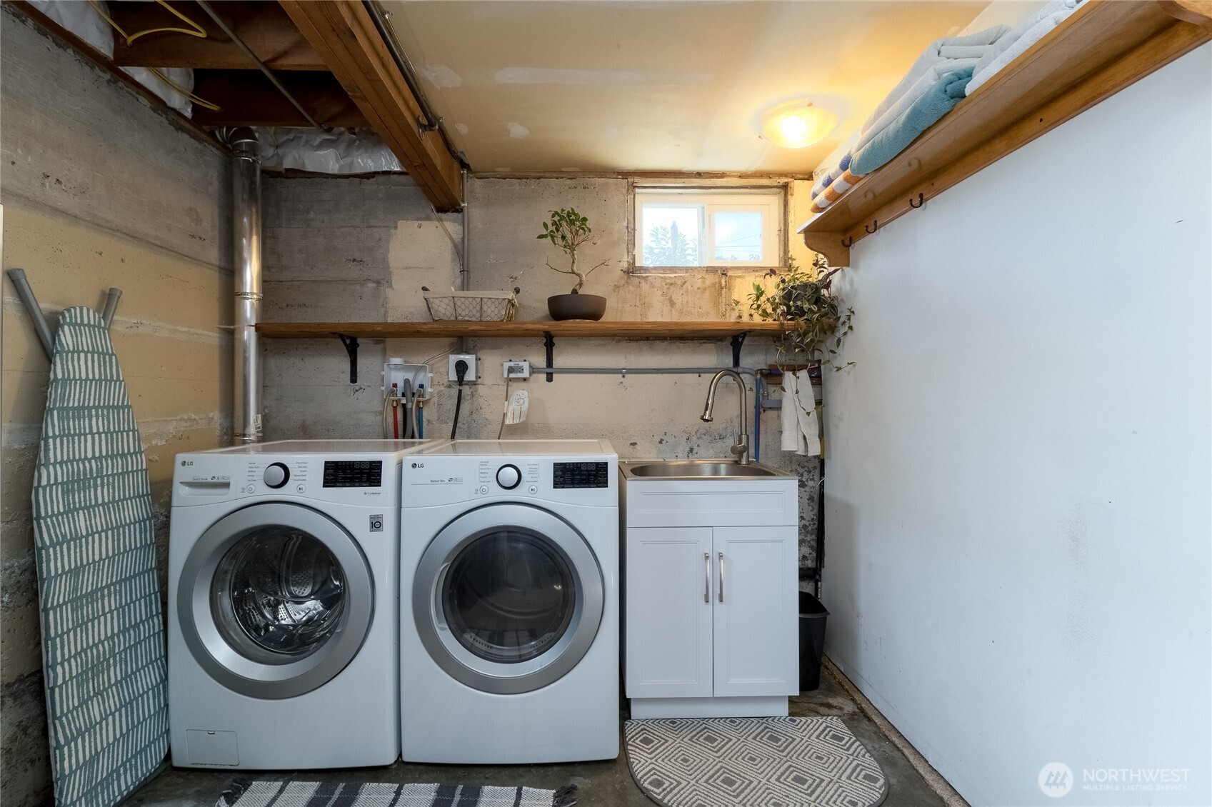 1028 University Street Walla Walla, WA 99362 - Photo 18 of 27 a view of storage and utility room with washer and dryer