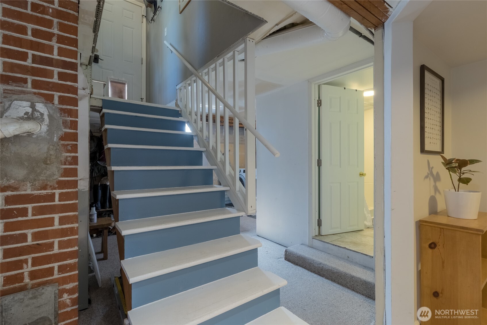 1028 University Street Walla Walla, WA 99362 - Photo 19 of 27 a view of staircase with white walls and a window