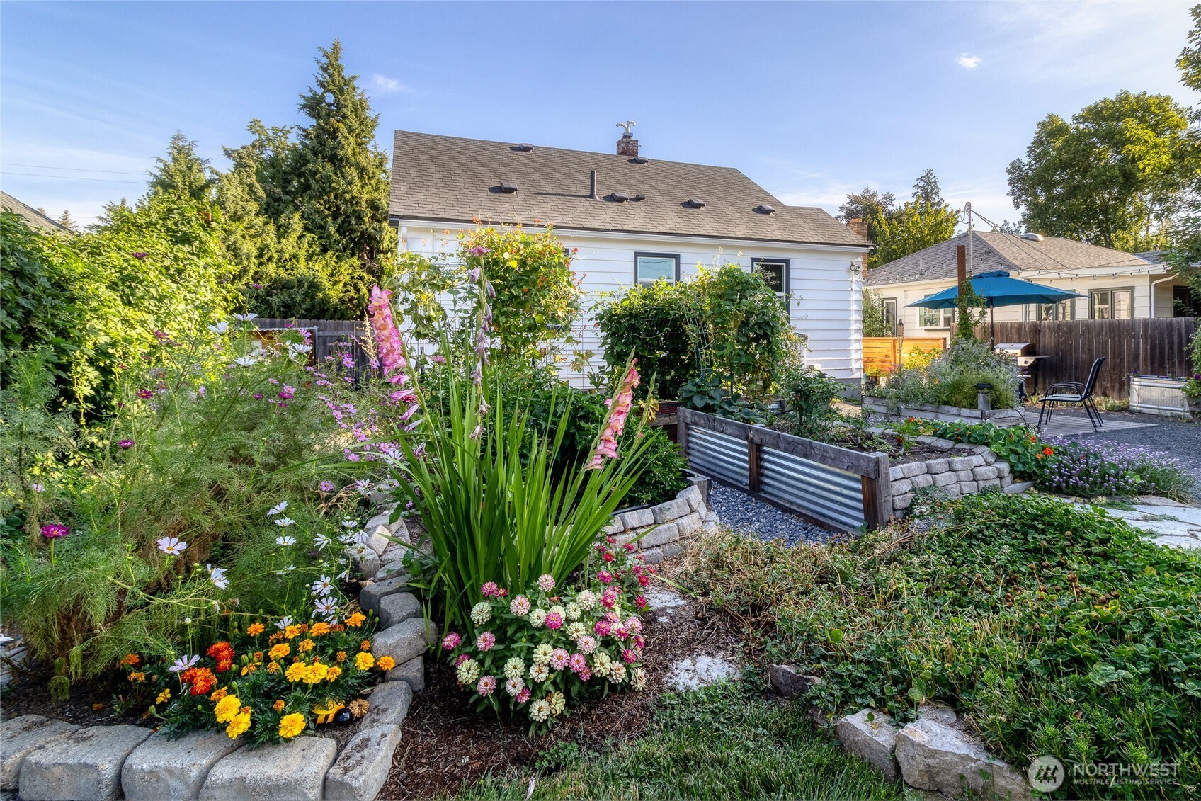 1028 University Street Walla Walla, WA 99362 - Photo 23 of 27 a view of a house with a garden and plants