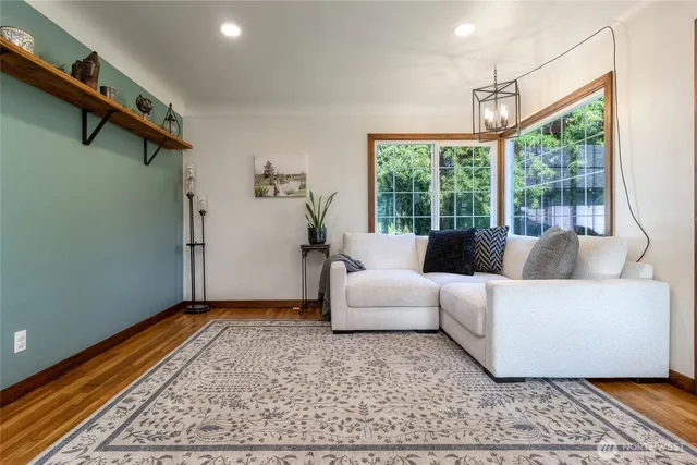 a living room with furniture and a rug