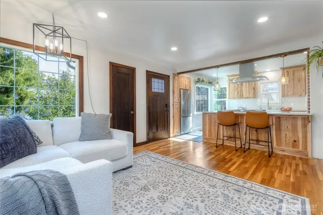 a living room with furniture and a large window
