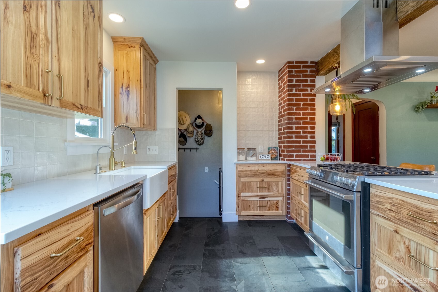 1028 University Street Walla Walla, WA 99362 - Photo 9 of 27 a kitchen with stainless steel appliances a stove and a sink
