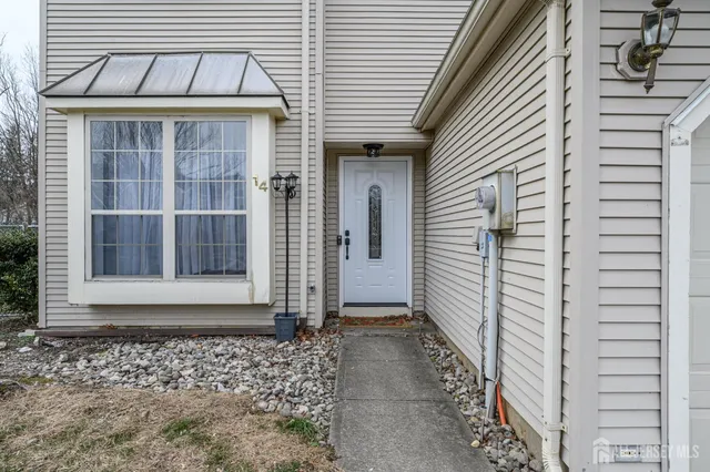 a view of a house with a door and wooden floor