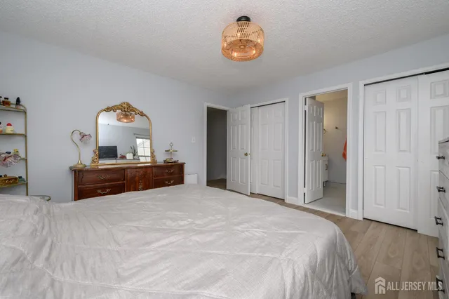 a bedroom with a bed and a table in it