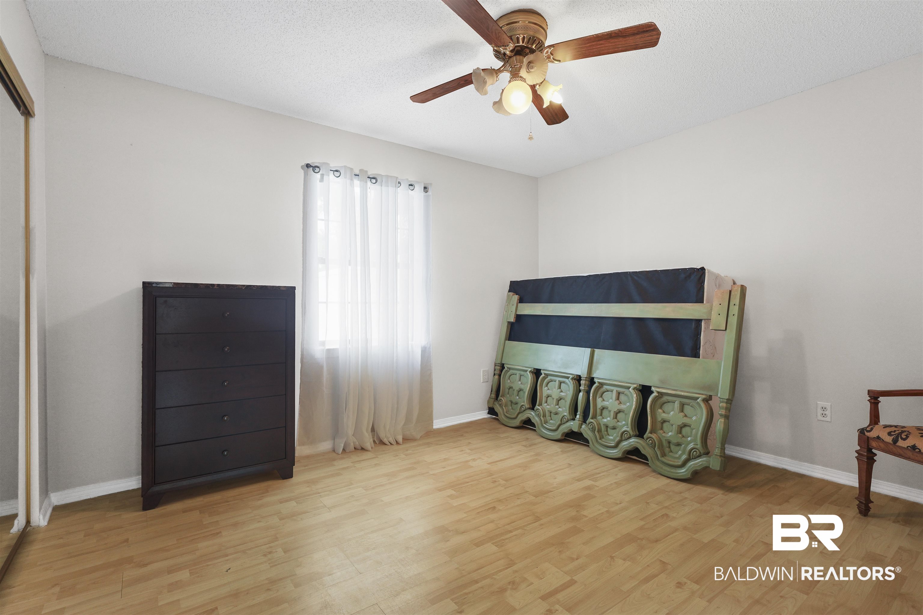 507 West Amanda Avenue Foley, AL 36535 - Photo 11 of 23 Bedroom with light wood-type flooring, ceiling fan, and a textured ceiling