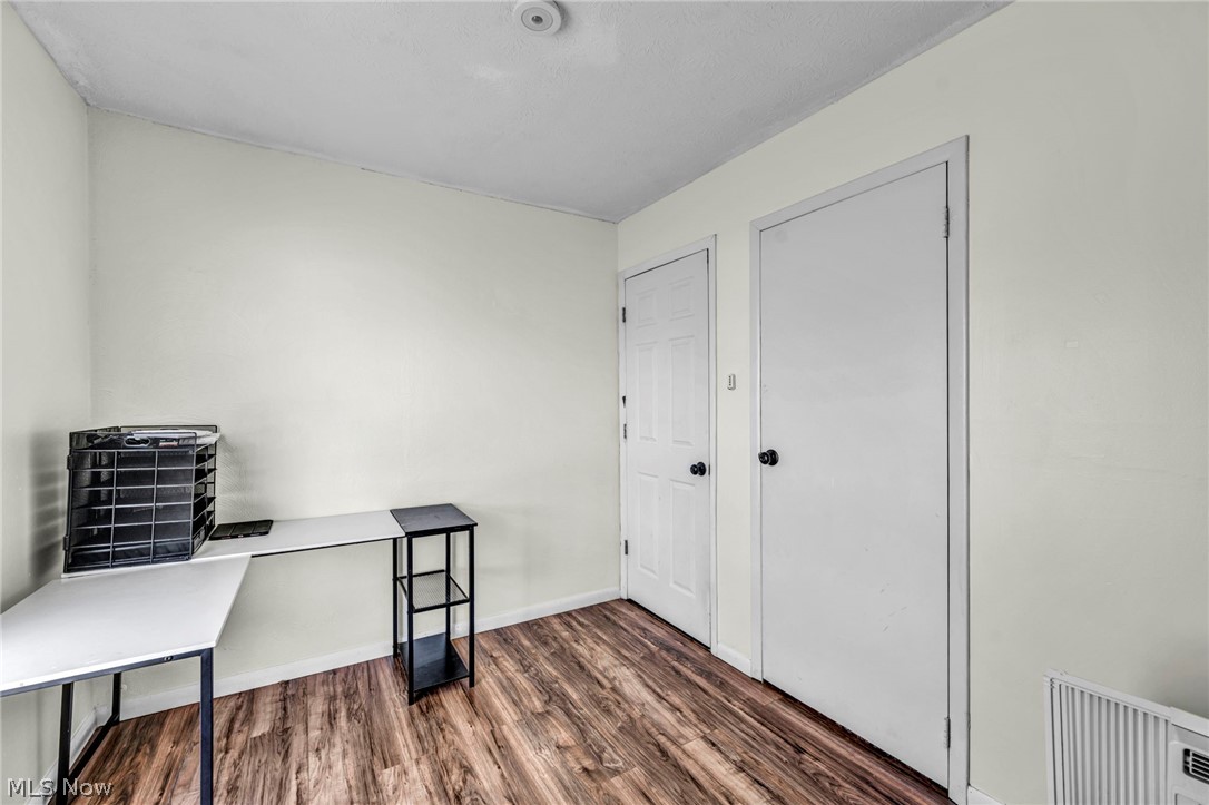 54 Park Road Painesville, OH 44077 - Photo 15 of 38 Office area featuring dark wood-style flooring and baseboards