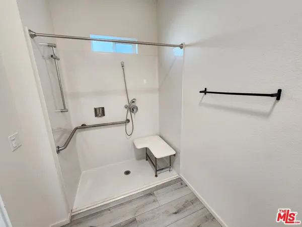 a bathroom with a glass shower door