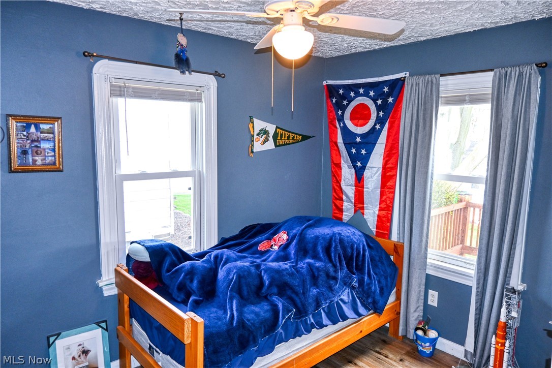 94 North 5th Street Rittman, OH 44270 - Photo 9 of 27 Bedroom with a ceiling fan and wood style finished floors