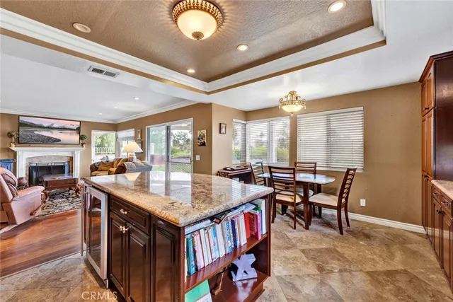 a view of kitchen island a sink and living room