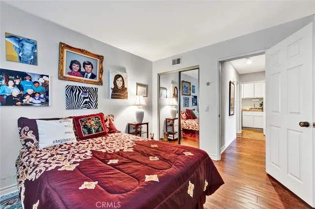 a bedroom with a bed and a walk in closet